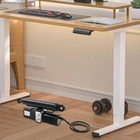Heavy Duty 12V Linear Actuator Built Solid To Crush Heavy Loads Without Breaking A Sweat Featuring Fast Stroke Speed And Industrial Grade Steel For Any Rigged Up Project on a wooden floor near an adjustable desk.