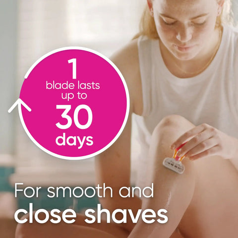 Woman using Extra Smooth Travel Razor Kit For Women With Mini Handle Refill And Case, Five Blade Shave System Delivers Close, Silky Shaves On The Go, Lubrication Strip Helps Protect Skin From Irritation in bathroom.