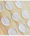 Clear Glass Table Top Anti Slip Bumper Pads 3mm Thick Non Adhesive Rubber Spacers Dots on wooden surface