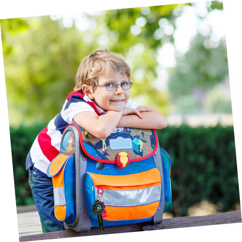 Child with backpack featuring Three Pack Survival Whistles Keychain With Directional Indicator for outdoor use