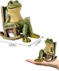 Mini Frog Garden Statue With Solar Lights, Cute Fairy Garden Decor, resin material, size 3.89 x 2.36 x 3.93 inches shown with hand for scale.