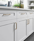 Reeded 5 Inch Center To Center Bar Pull In Honey Bronze Durable Cabinet Hardware With Classic Look, Smooth Operation, Everyday Use Ready, Built To Last, Perfect For Kitchens And Bathrooms, on white kitchen cabinets