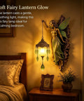 Fairy Lamp Vintage Wall Sconce, Hand-Painted Wing Design Dimmable, green glowing softly beside a bed in a calming bedroom.