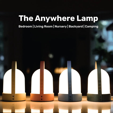 Four versions of the Kin Portable Cordless Lantern Table Lamp With USB Rechargeable 4000mAh Battery glowing in a dark room.