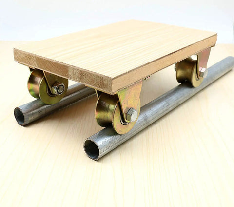 Heavy Duty U Groove Track Wheels For Sliding Gates And Barn Doors Galvanized Steel Rollers 45 lbs Capacity Industrial Grade Casters Built Tough Reliable on wooden platform over metal rails.