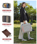 Woman carrying Four Piece Carry On Luggage Set That Really Fits Airline Size Rules, 21 Inch Softside Carry On with Spinner Wheels.