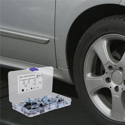 Top Rated 120 Piece Automotive Grease Fittings Kit With Assorted Sizes Including Metal Nipples And Caps For Car Machinery Maintenance, Replacement Parts, And Heavy Duty Equipment That Ensures Smooth Operation. 120-piece plastic case beside car wheel