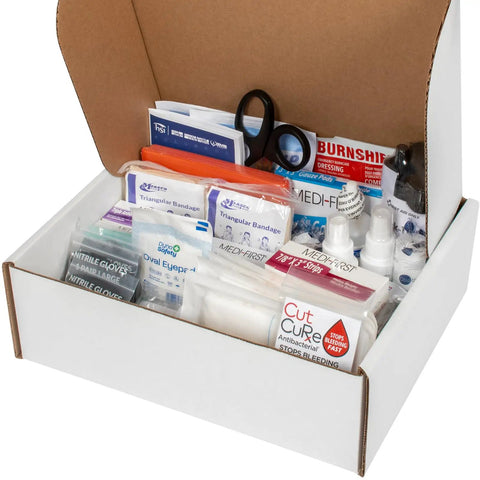 Open box of ANSI 2021 Class B First Aid Kit Refill Pack with 160 pieces, heavy duty Medifirst bandages, burn gel packets, OSHA compliant supplies.
