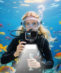Diver using Ultra Bright Waterproof Dimmable Underwater LED Light For GoPro Hero And DJI Osmo Action, exploring colorful fish at 147ft depth.