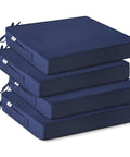 Stack of four navy blue all weather outdoor chair cushions with ties and handles, 19x19x3 inches, waterproof and durable.