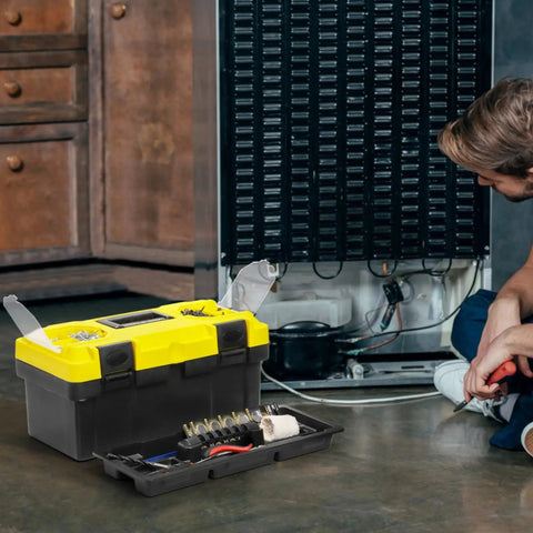 16 Inch Plastic Toolbox With Handle Portable Toolbox With Removable Tray and Lockable Design Built Tough For Home Workshop or Garage With Small Parts Box in Black and Yellow next to a repairman working.