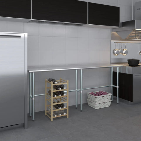 Rock Solid Heavy Duty Stainless Steel Work Table With Open Base Commercial Grade Metal Prep Bench For Restaurants Garages And Workshop Areas 84 Inch Long By 14 Inch Deep positioned in a modern kitchen.