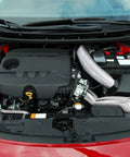 Car engine with Two Rolls Heavy Duty Aluminum Foil Tape Heat Shield Reflective Barrier for sealing and insulation visible on pipes.