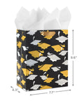 Medium Graduation Gift Bag With Tissue Paper Featuring Gold And Silver Mortarboards On Black For College High School Eighth Grade Kindergarten And Nurses Gift Ready, showing front view.
