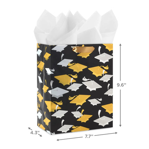 Medium Graduation Gift Bag With Tissue Paper Featuring Gold And Silver Mortarboards On Black For College High School Eighth Grade Kindergarten And Nurses Gift Ready, showing front view.