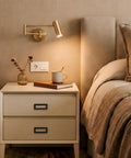 Bedroom scene with nightstand featuring hidden furniture handle recessed flush door pull three point seven five inch hole center matte black.
