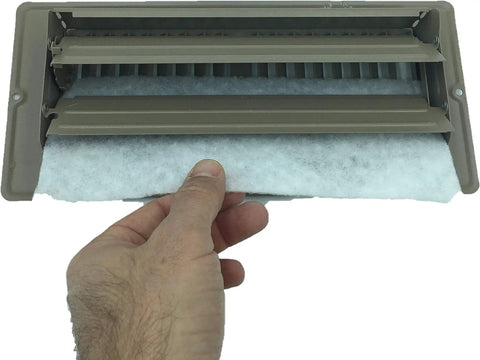Hand inserting polyester Floor Vent Register Filters 4x12 Inch Breath Easy Everyday With 90 Day Filtration into vent