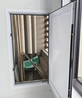 Heavy Duty Aluminum Access Panel For HVAC Ducts 14x30 Inch Inspection Hatch open showing interior view with pipes and wall.