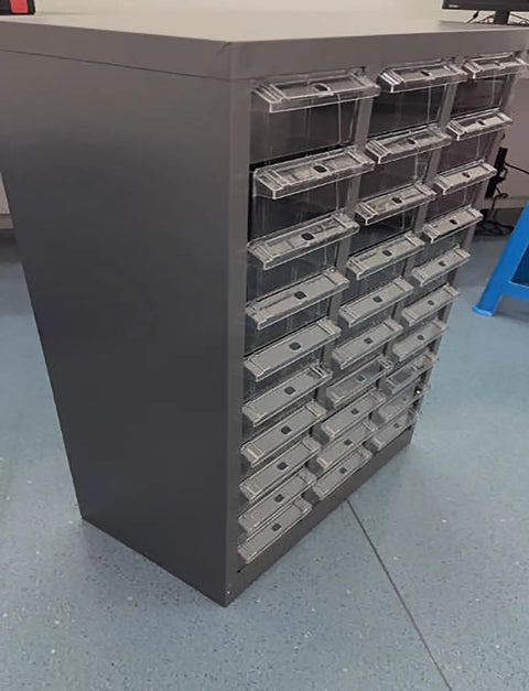 Tough Build Impact Resistant Stainless Steel Hardware Cabinet Featuring Six Spacious Drawers with clear fronts for easy access.