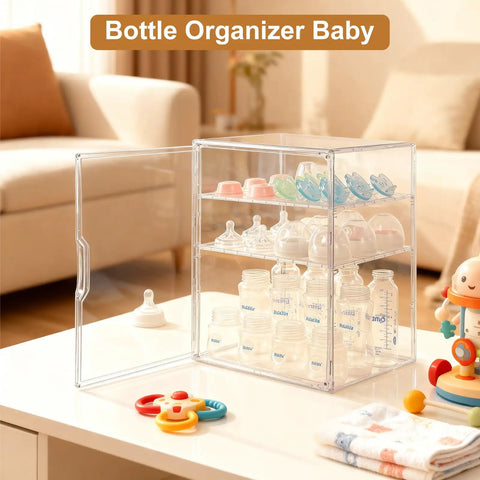 Three Tier Baby Bottle Organizer With Removable Dividers For Bottles Nipples Pump Parts And Food Jars Clear Acrylic Bottle Station For Countertop And Kitchen Perfect Gift For Busy New Moms shown on a table with baby toys and a couch in background