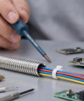 Heavy Duty Stainless Steel Bendable Conduit Sleeve For Weatherproof Cable Management used for secure wiring with various colored cables.