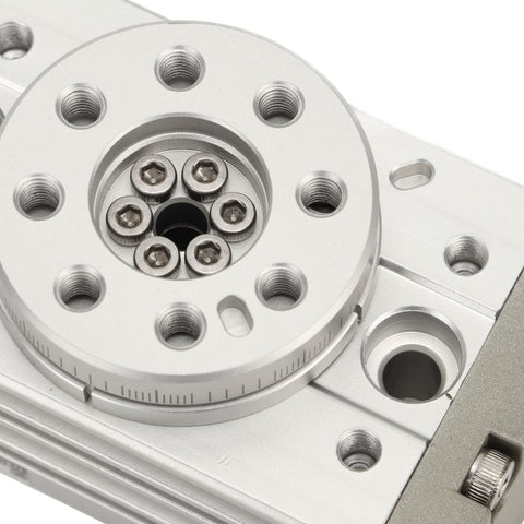 Pneumatic rotary actuator with silver aluminum housing, circular mounting flange and multiple bolt holes (front view).