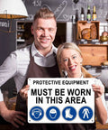 Protective Equipment Must Be Worn In This Area Sign Built Tough Aluminum 8 By 12 Inches held by two smiling individuals
