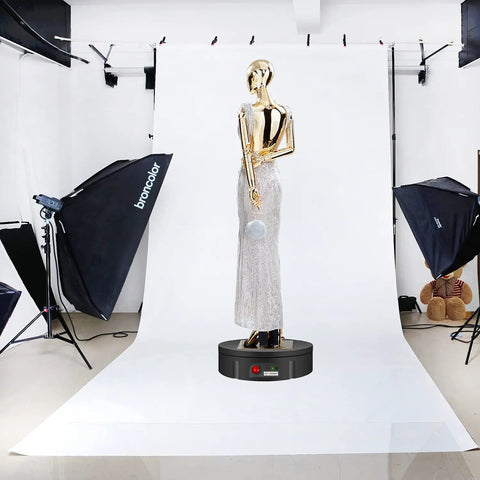 JAYEGT Motorized Rotating Display Stand With Remote Control And 5 Color Backgrounds showcasing a mannequin in a photography studio.