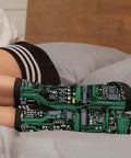 Printed Circuit Board Socks Dope Nerdy Crew Socks For Men And Women With Cushioned Soles Soft Polyester Spandex Blend One Size Fits Most Funny Tech Gift For Geeks And Gamers, worn on feet resting on bed, circuit pattern visible