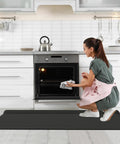 Game Changing Anti Fatigue Kitchen Mat Set With Memory Foam Runner And Sealed Dust Proof Edges For Standing Comfort In Kitchens And Offices Total Leg Relief And Built For Long Run Durability, in use near an oven.