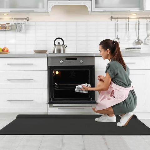 Game Changing Anti Fatigue Kitchen Mat Set With Memory Foam Runner And Sealed Dust Proof Edges For Standing Comfort In Kitchens And Offices Total Leg Relief And Built For Long Run Durability, in use near an oven.