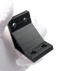 Close-up of a black 2040 aluminum extrusion corner bracket, part of a 14 Pack 2040 Aluminum Extrusion Corner Brackets 90 Degree Right Angle L Connectors With T Slot Nuts And Bolts For 2040 20 40 Extruded Aluminum Profile Build Kit, held by a gloved hand.