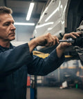 Mechanic using Ford 4 Lug Rear Axle Nut Socket Wrench For F Series Trucks Ten And A Half Inch Spindle Nut on vehicle