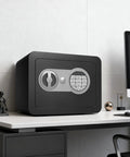Slick Compact Home Safe Box With Coin Slot And Digital Keyboard Personal Safe For Money Cash And Documents Kids Safe Box With Sensor Light Mini Safe 0.23 Cubic Feet Black on desk next to computer