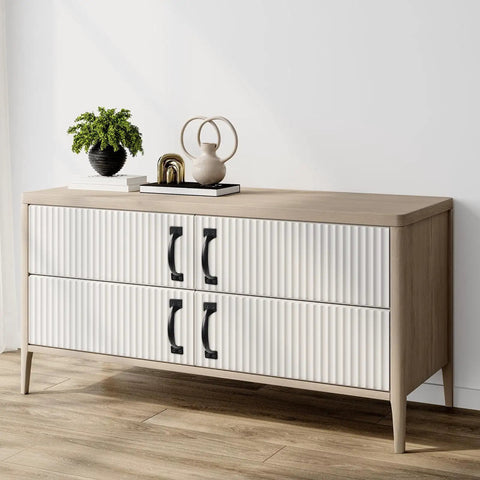 White dresser with ribbed drawers and black six-piece 5 inch rustic gate handle set, placed in a modern living room corner.