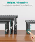 Go To Adjustable Desk Monitor Stand With Laptop Riser And Under Desk Storage, showing adjustable height feature with hand.