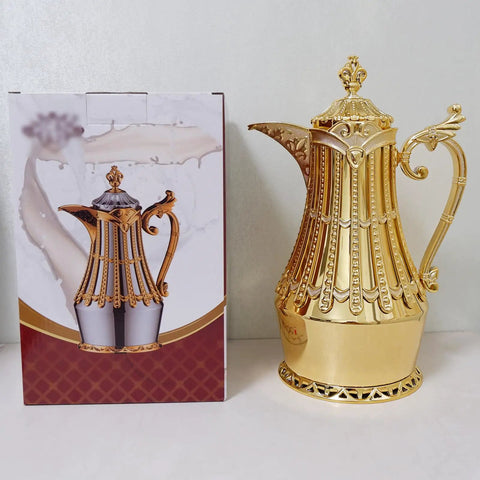 Arabic And Turkish Style Luxury Insulated Coffee Carafe 34 Oz Vacuum Bottle For Hot Or Cold Beverages Gold Finish next to box