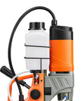 Close-up of the Badass Magnetic Drill Press with 1450W motor, coolant bottle and hose for heavy steel boring jobs.