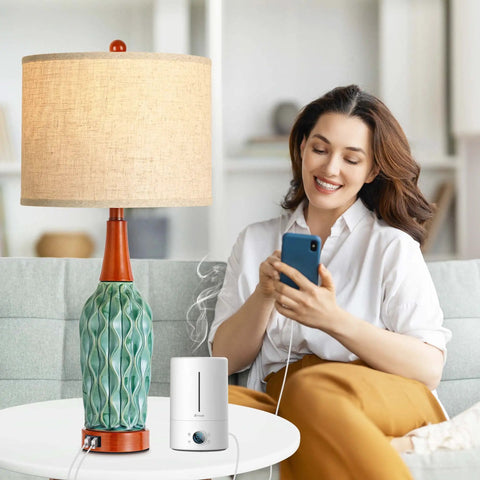 Vintage Ceramic Table Lamps Set Of 2 For Your Living Room And Bedroom Teal MCM Style Nightstand Lamps With USB Port 3 Way Dimmable Oatmeal Linen Shade Bulb Included next to a smiling woman using a phone.