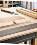 Wooden table with tools, possibly for Grandfather Clock Replacement Weights And Shell Hook Kit For Vintage Restoration, shown flat on surface.