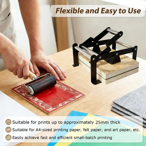 Versatile Hand Lever Linocut Printing Press With Rubber Roller and Felt Pad in use for A4 linocut print on wooden table.