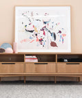 Wooden sideboard with Matte Black Edge Finger Pulls 10 Pack, Concealed Drawer Handles With 10 Inch Hole Centers, décor items and art.