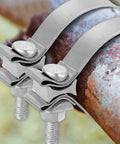 Close-up of 2 Pack 410 Stainless Steel Exhaust Clamp Set Adjustable from 1.69 Inch to 1.97 Inch Narrow Band Butt Joint on rusted pipe.