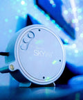 Sky Lite LED Laser Star Projector with green stars and blue nebula for gaming rooms and home theaters, close-up view