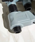 Close-up of water connector with hoses for Automatic Yard Watering System With Four Station Sprinkler Setup Large Digital Display Easy Dial Controls And Three Start Times For Smart Effortless Lawn And Garden Hydration