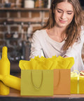 Woman arranging Bright Yellow Tissue Paper Sheets 20 By 14 Inches Pack of 100 For Gift Bags Wrapping Paper DIY Crafts Party Decor
