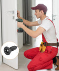 Person using a drill to install a door with 100 Pack Flat Head Torx Screws M3 X Ten Millimeter 304 Stainless Steel.