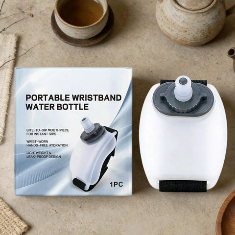 Silicone Wrist Bottle With Hand Strap For Ultra Portable Hydration On The Go shown with packaging on a table