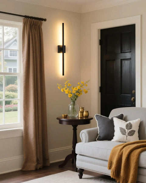 Cordless Black Rechargeable Wall Sconce With Remote 8000Mah Battery Operated mounted on wall beside beige curtains and cozy couch.