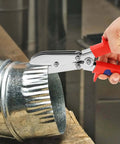 Five Blade Hand Crimper Pro Grade Heavy Duty Rust Resistant Gutter Crimping Tool with Ergonomic Handle in use on metal duct